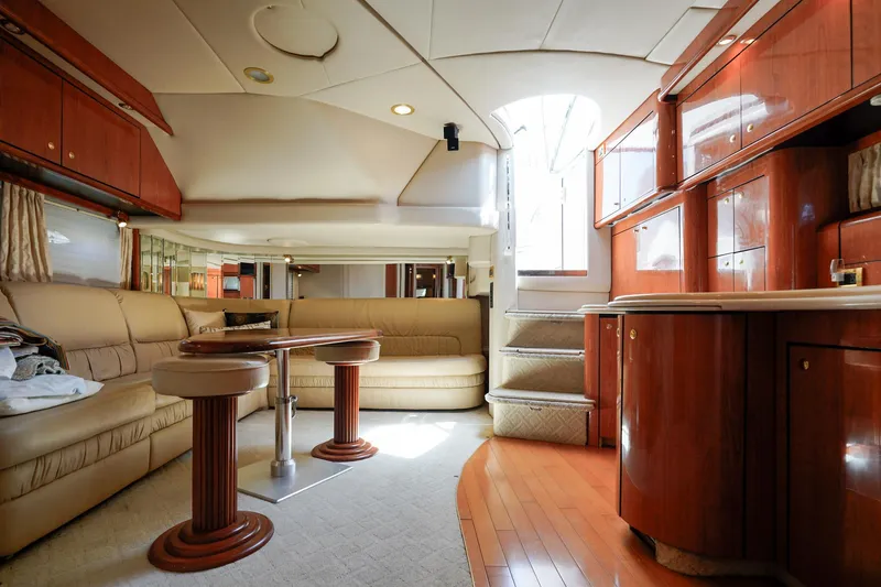 Slide: The Image of Luxurious interior of a 2000 Sea Ray 510 Sundancer yacht with elegant wood finishes. - 7
