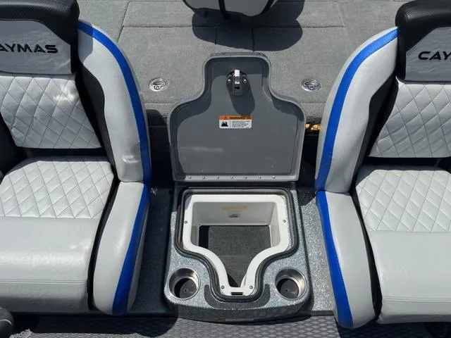 Slide: The Image of 2025 Caymas CX21 Pro boat seats with center storage and cup holders. - 23