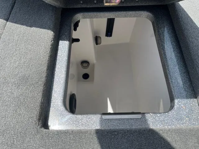 Slide: The Image of 2025 Caymas CX21 Pro storage compartment with open lid, showcasing interior details. - 26