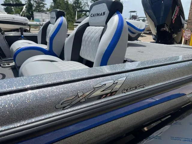 Slide: The Image of 2025 Caymas CX21 Pro boat with sleek design and comfortable seating. - 29