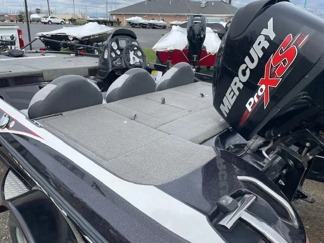 Slide: The Image of 2013 Nitro Z-6 boat with Mercury Pro XS engine, featuring gray seating and deck. - 4