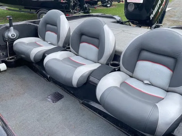 Slide: The Image of 2013 Nitro Z-6 boat interior with three gray and white cushioned seats. - 8