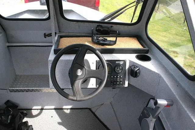 Slide: The Image of 2003 Hewescraft 160 Sportsman boat interior with steering wheel and control panel. - 8