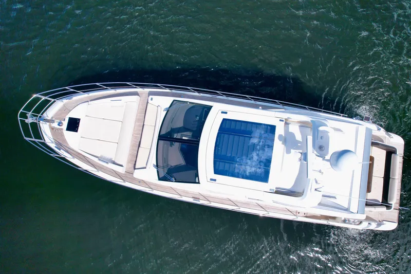 Slide: The Image of Aerial view of 2015 Azimut 55S yacht cruising on water. - 11