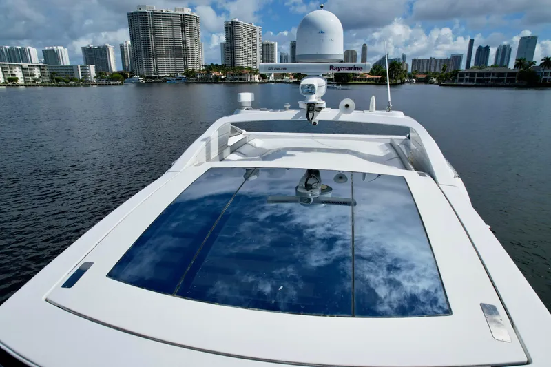 Slide: The Image of Azimut 55S 2015 yacht on water with city skyline in background. - 12