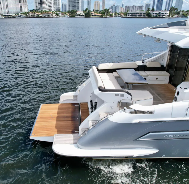 Slide: The Image of 2015 Azimut 55S yacht on water, featuring sleek design and spacious deck. - 18