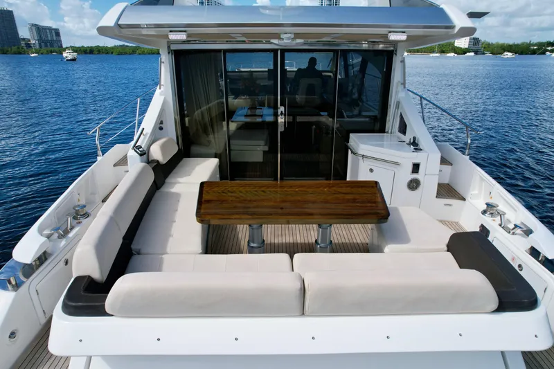 Slide: The Image of Luxurious 2015 Azimut 55S yacht with spacious outdoor seating and dining area. - 24