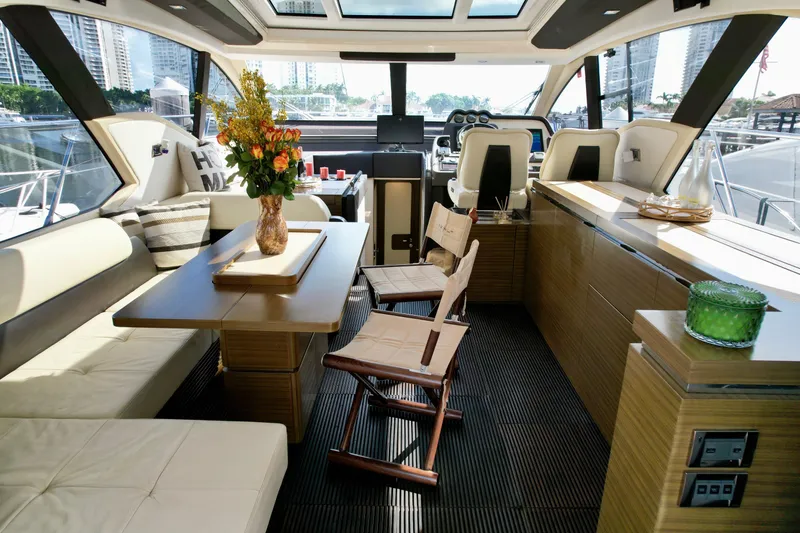 Slide: The Image of Luxurious interior of 2015 Azimut 55S yacht with elegant seating and dining area. - 26