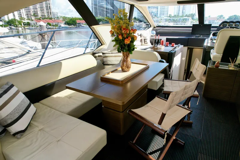 Slide: The Image of Luxurious interior of 2015 Azimut 55S yacht with elegant seating and floral centerpiece. - 29