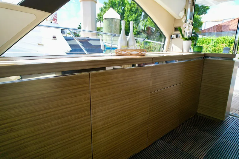Slide: The Image of Luxurious interior of 2015 Azimut 55S yacht with sleek wooden cabinetry and modern decor. - 31