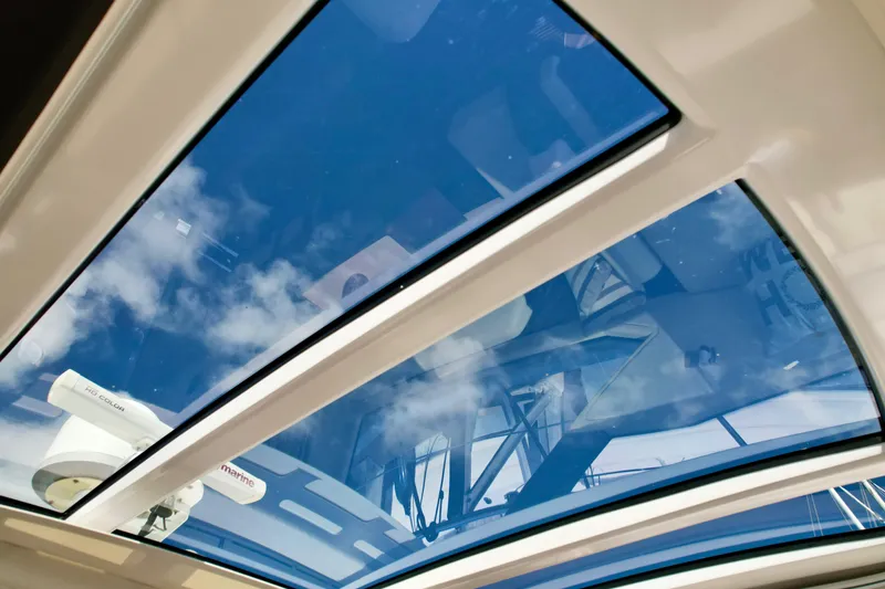 Slide: The Image of Glass sunroof of a 2015 Azimut 55S yacht, showcasing a clear blue sky. - 36