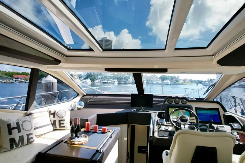 Slide: The Image of Luxurious interior of 2015 Azimut 55S yacht with panoramic windows and modern dashboard. - 39