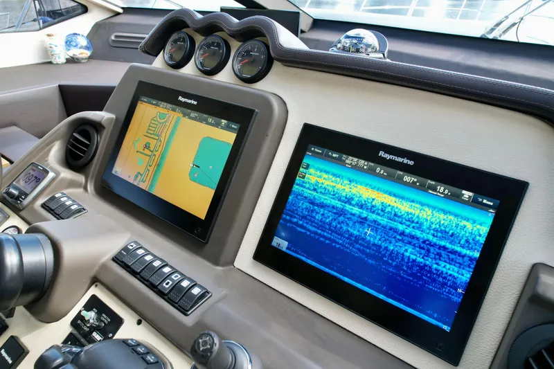 Slide: The Image of Control panel of a 2015 Azimut 55S yacht with Raymarine navigation displays. - 44