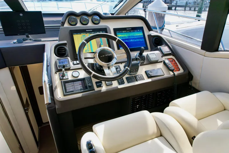 Slide: The Image of Cockpit of 2015 Azimut 55S yacht with advanced navigation controls and luxurious seating. - 45