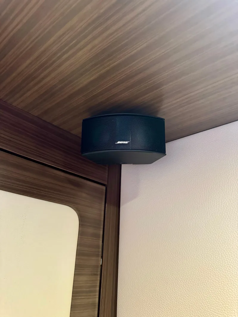 Slide: The Image of Bose speaker mounted on the ceiling of a 2015 Azimut 55S yacht interior. - 46