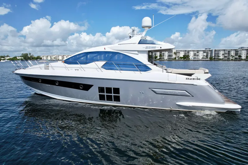 Slide: The Image of 2015 Azimut 55S yacht cruising on a sunny day with blue skies and calm waters. - 7