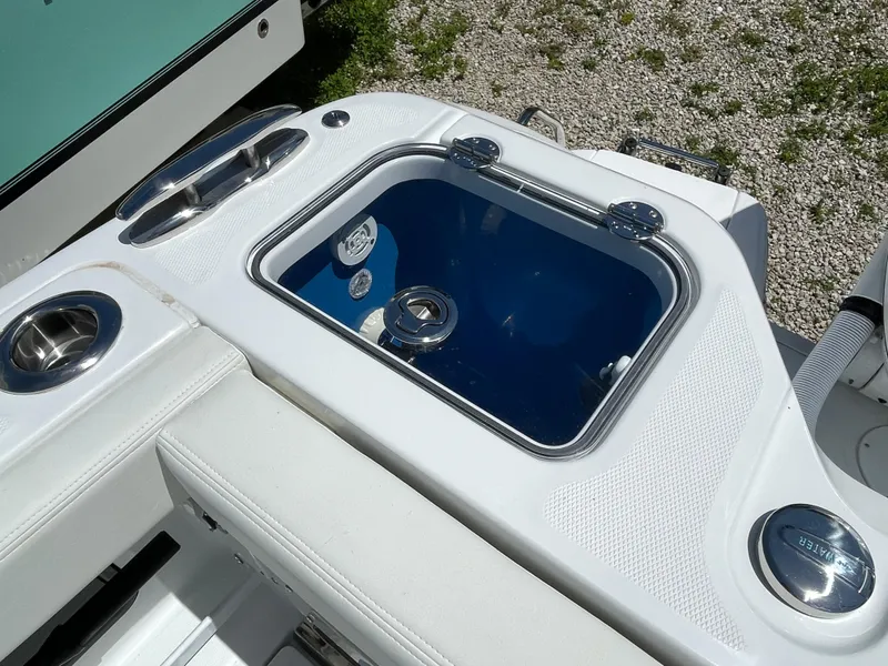 Slide: The Image of 2025 Everglades 315 Center Console boat with sleek white seating and built-in storage. - 10
