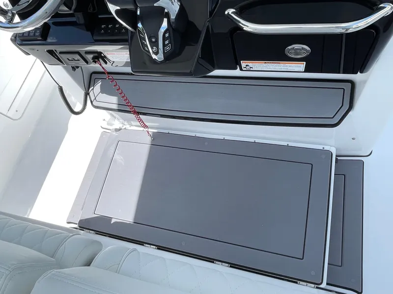 Slide: The Image of 2025 Everglades 315 Center Console boat interior with sleek dashboard and seating. - 19