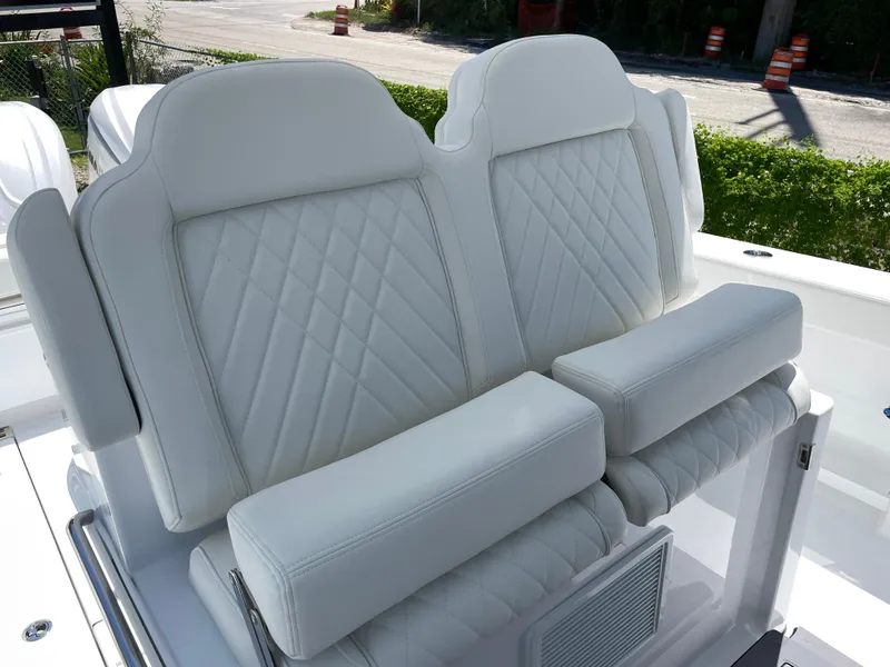 Slide: The Image of 2025 Everglades 315 Center Console boat with luxurious white leather seating. - 23