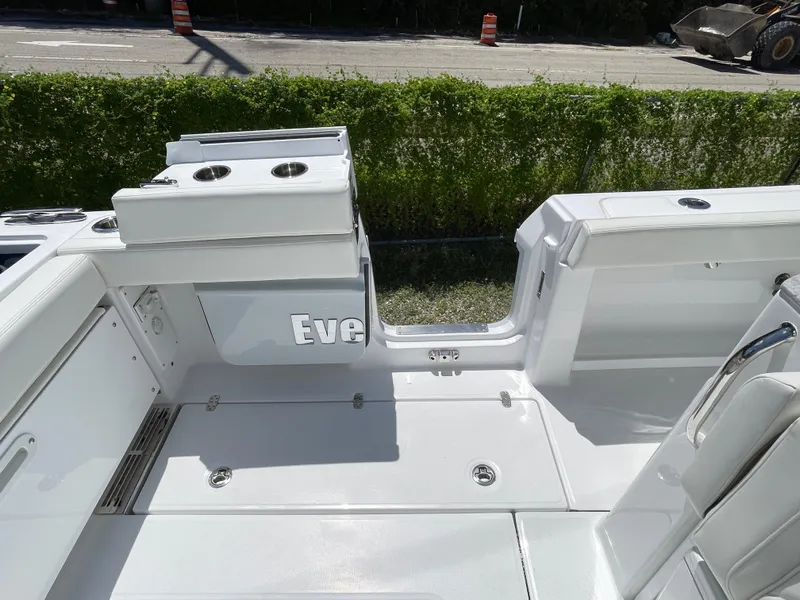 Slide: The Image of 2025 Everglades 315 Center Console boat interior with seating and storage compartments. - 25