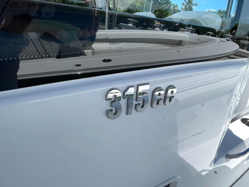 Slide: The Image of 2025 Everglades 315 Center Console boat with "315cc" emblem on the side. - 27