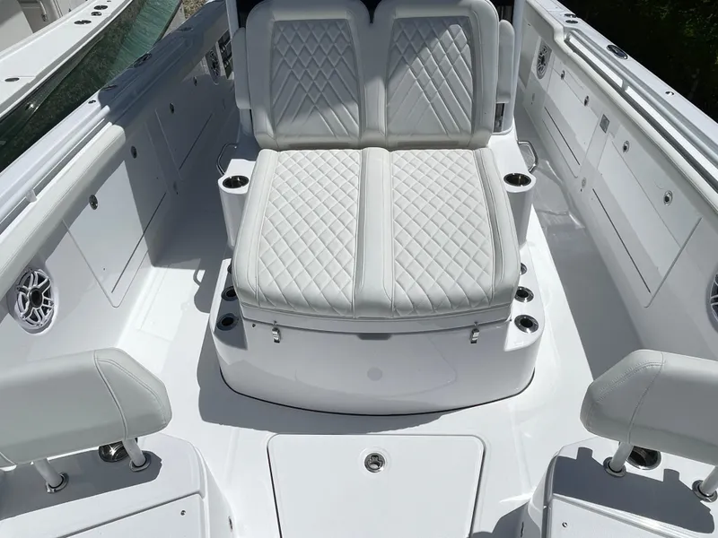 Slide: The Image of 2025 Everglades 315 Center Console boat with luxurious white seating and modern design. - 30