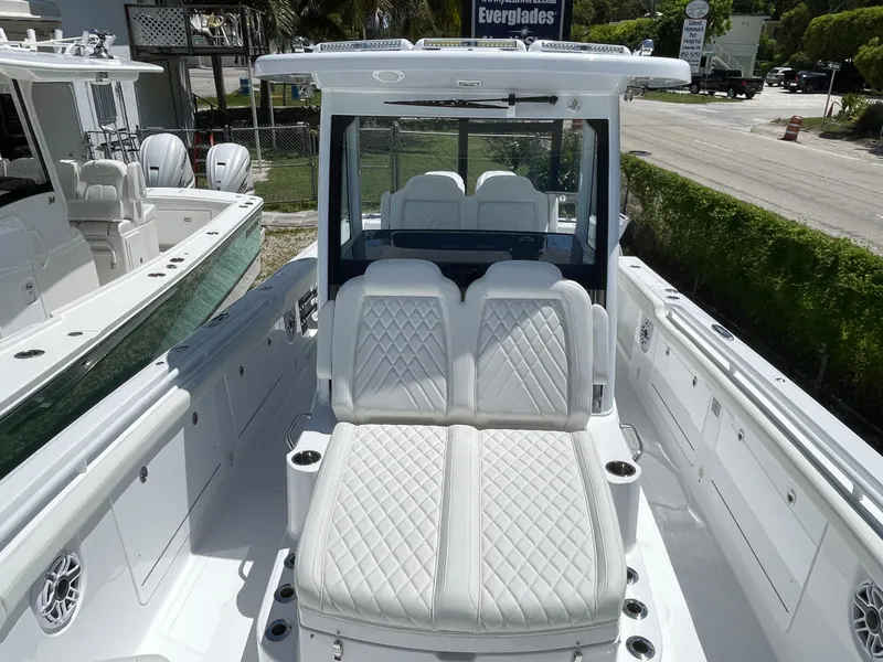 Slide: The Image of 2025 Everglades 315 Center Console boat with luxurious white seating and modern design. - 31