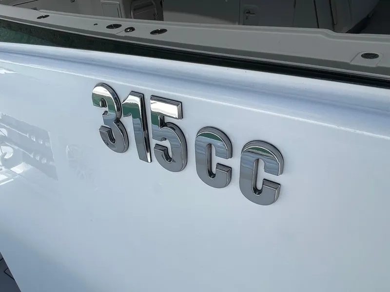 Slide: The Image of 2025 Everglades 315 Center Console boat emblem on white surface. - 35