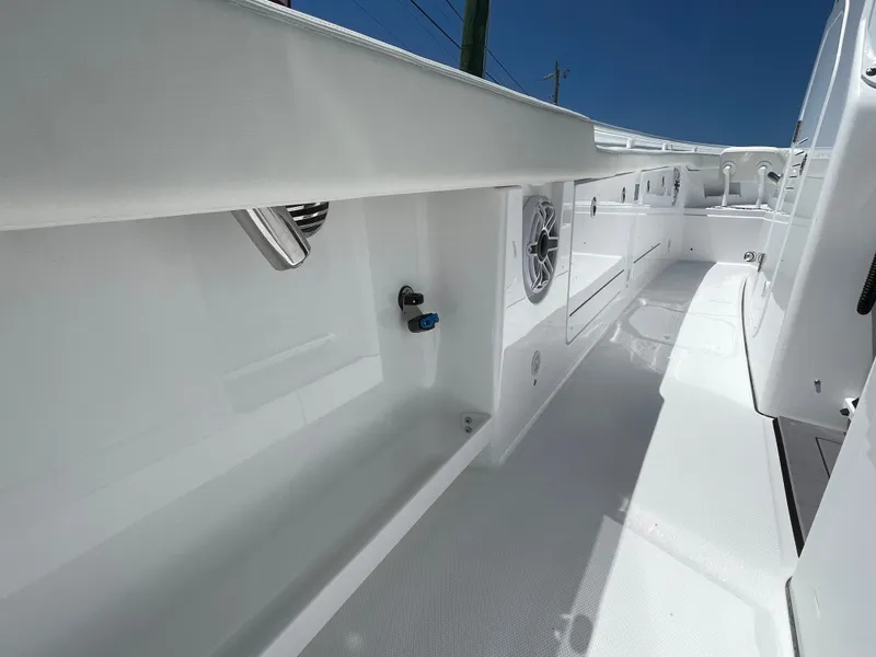 Slide: The Image of 2025 Everglades 315 Center Console boat interior, showcasing sleek white design and modern features. - 38