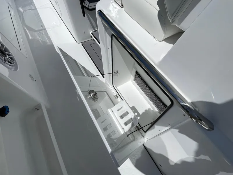 Slide: The Image of 2025 Everglades 315 Center Console boat interior with open storage compartment. - 39