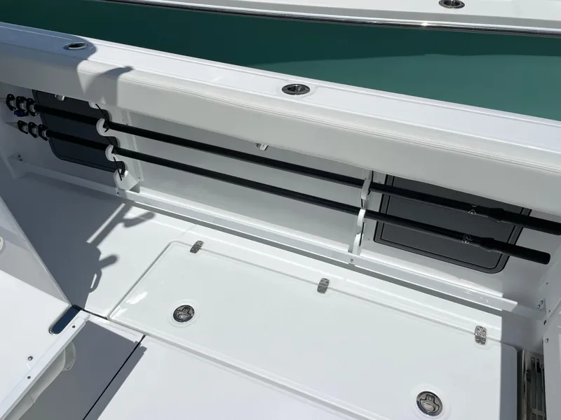 Slide: The Image of 2025 Everglades 315 Center Console boat interior with rod holders and storage compartments. - 48