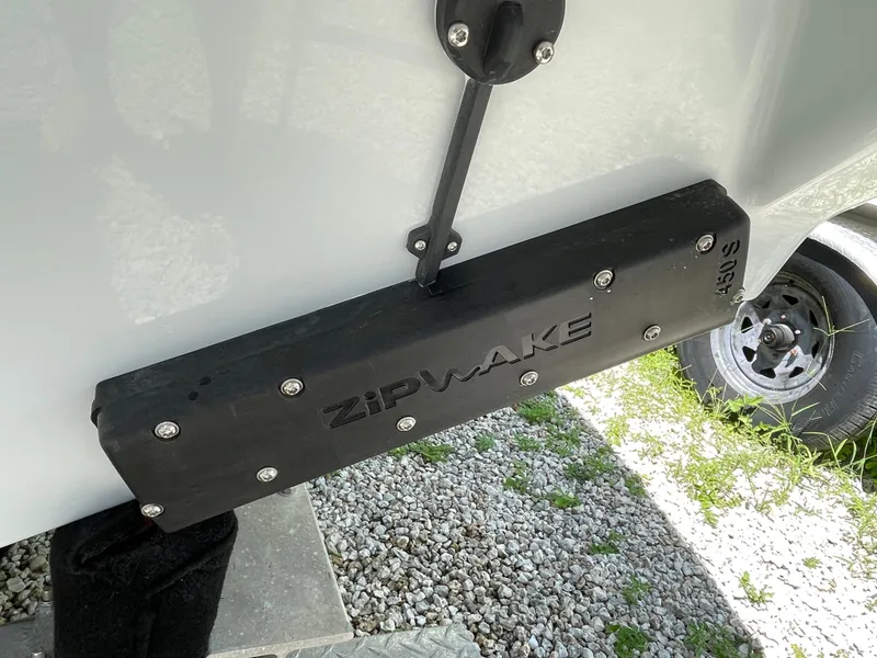 Slide: The Image of Trim tab on 2025 Everglades 315 Center Console boat, featuring Zipwake technology. - 5