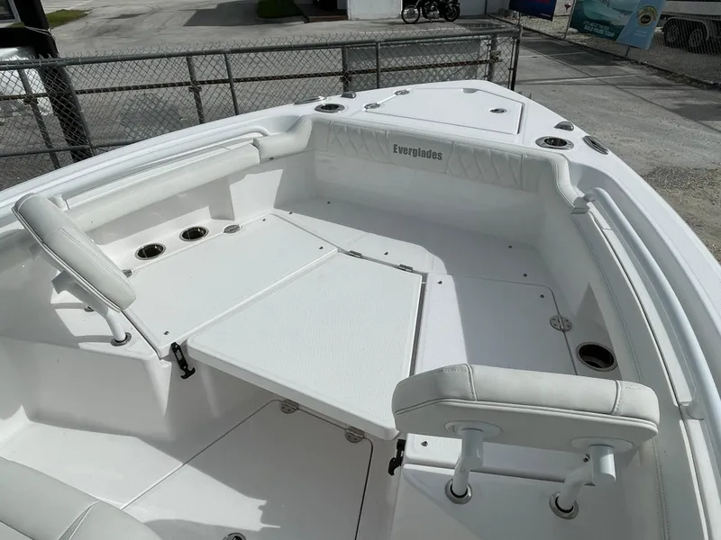 Slide: The Image of 2023 Everglades 235CC boat interior with seating and storage compartments. - 11