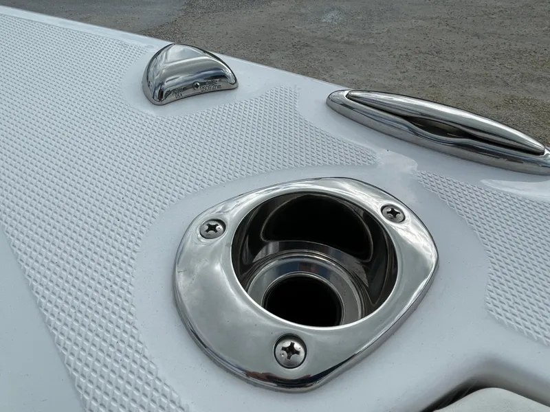 Slide: The Image of 2023 Everglades 235CC boat deck with stainless steel fittings and textured surface. - 26