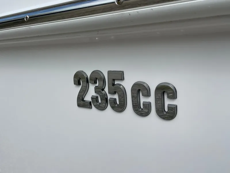 Slide: The Image of Everglades 235CC boat model emblem, 2023 edition, on white surface. - 3