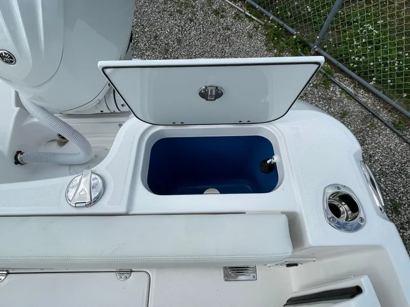 Slide: The Image of Open storage compartment on 2023 Everglades 235CC boat, featuring sleek design and functionality. - 31