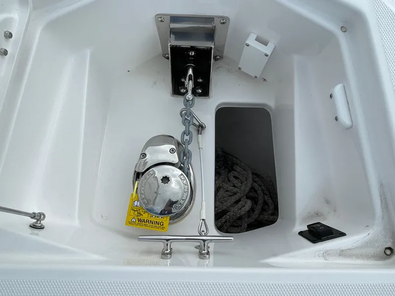 Slide: The Image of Anchor compartment of 2023 Everglades 235CC boat with chain and rope storage. - 6