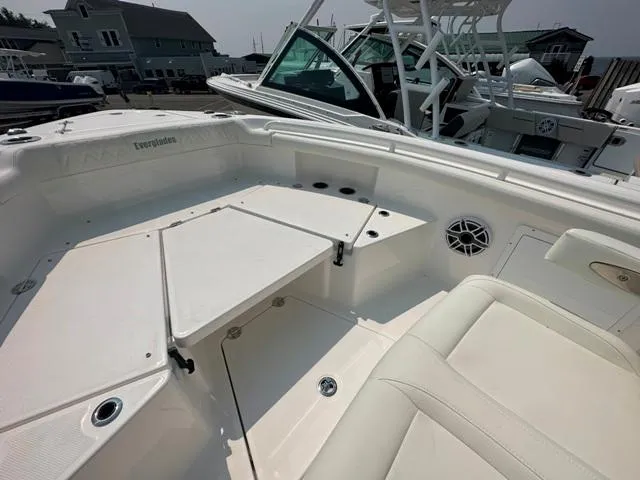 Slide: The Image of 2023 Everglades 235CC boat interior with seating and storage compartments. - 7