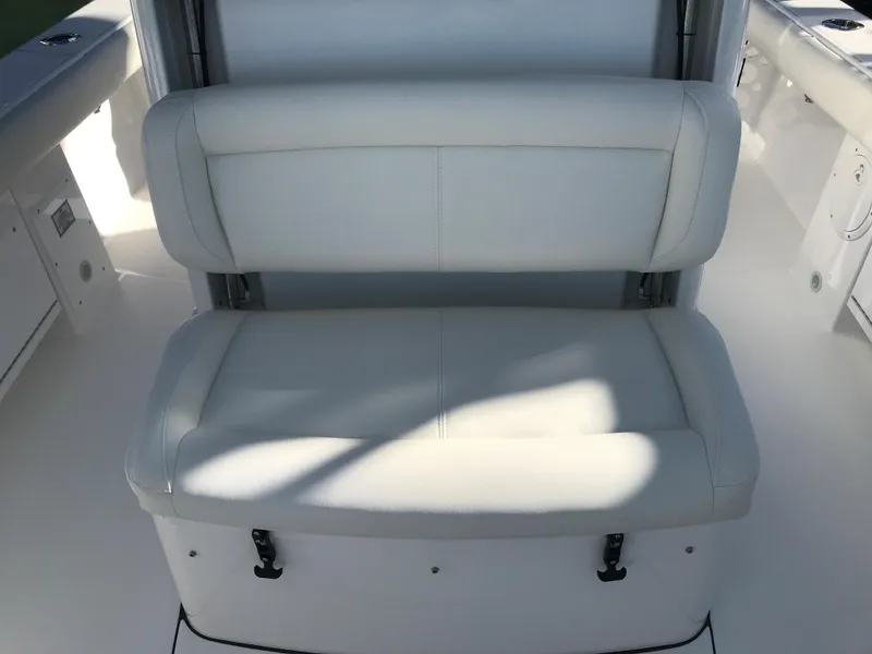 Slide: The Image of 2023 Everglades 273CC boat seat with white cushioned upholstery. - 10