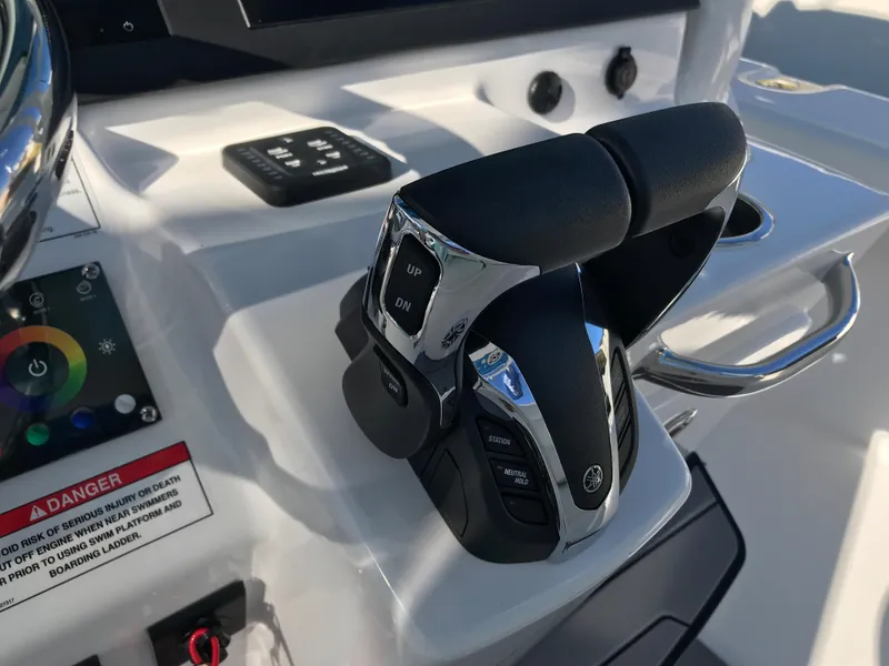Slide: The Image of Throttle controls on 2023 Everglades 273CC boat dashboard, featuring modern design and functionality. - 14
