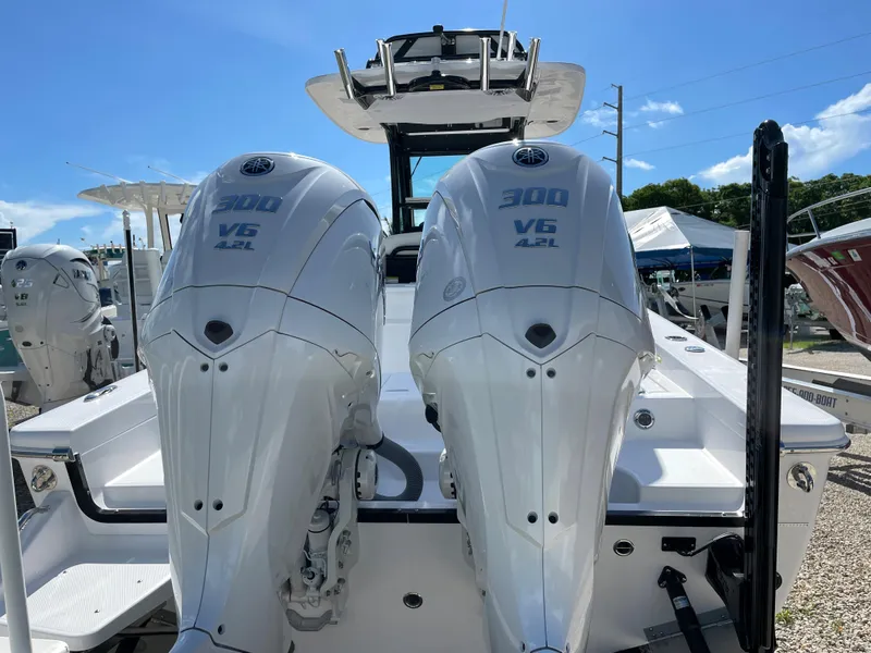 Slide: The Image of 2023 Everglades 273CC boat with dual 300 V6 engines, rear view. - 21