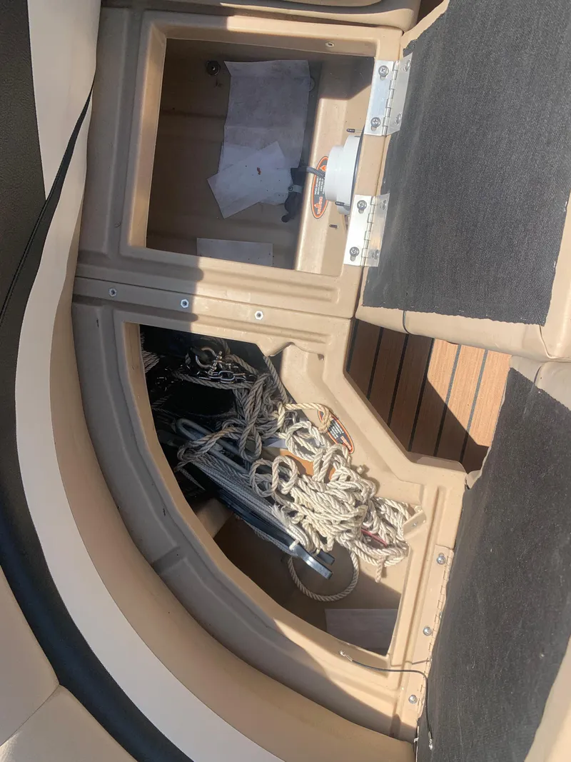 Slide: The Image of Storage compartment on a 2014 Harris FloteBote 200 Cruiser CS with ropes and anchor. - 19