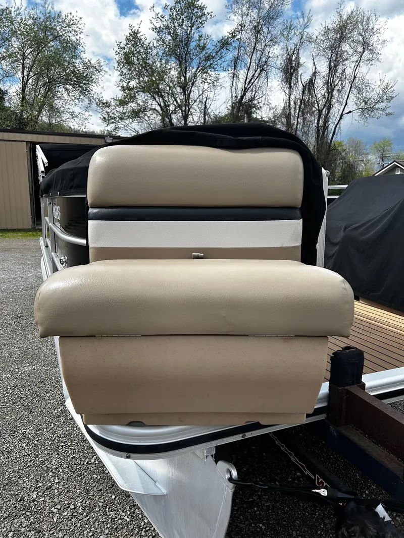 Slide: The Image of 2014 Harris FloteBote 200 Cruiser CS pontoon boat with beige seating, parked outdoors. - 5