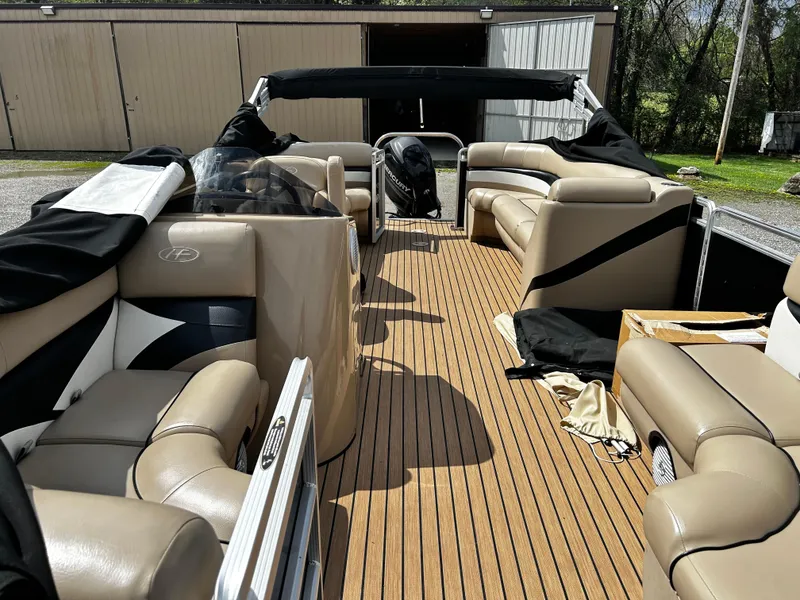 Slide: The Image of 2014 Harris FloteBote 200 Cruiser CS pontoon boat with beige seating and wooden deck. - 7