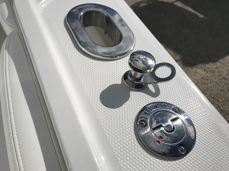 Slide: The Image of 2023 Regulator 23 boat deck with chrome fittings and textured surface. - 10