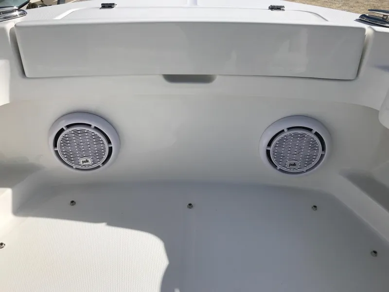 Slide: The Image of 2023 Regulator 23 boat with dual speakers on the interior panel. - 12