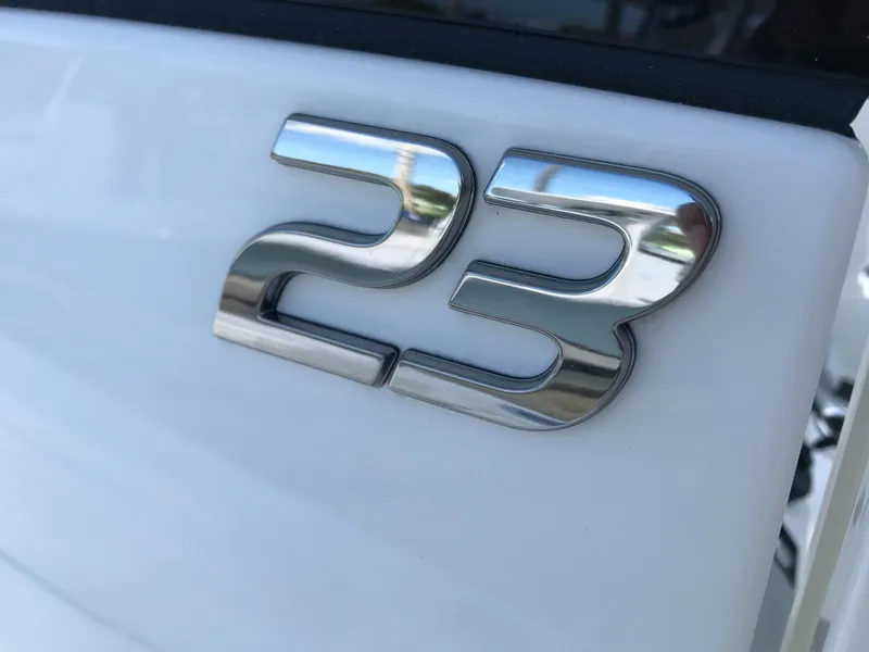 Slide: The Image of Chrome "23" emblem on a 2023 Regulator boat. - 16