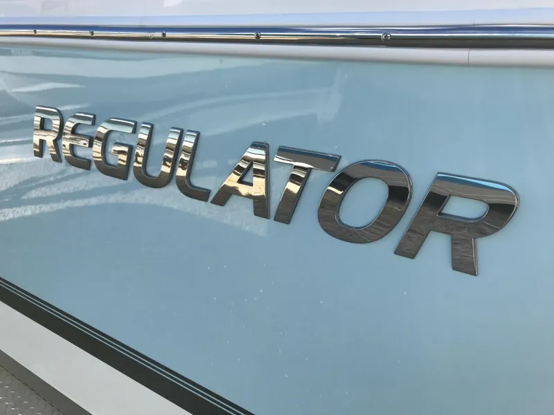 Slide: The Image of 2023 Regulator 23 boat logo on light blue hull. - 29