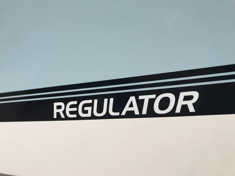 Slide: The Image of Regulator 23 boat logo, 2023 model, featuring sleek design and bold lettering. - 3