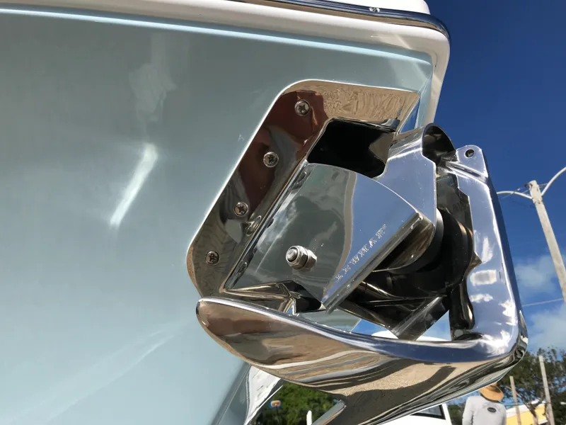 Slide: The Image of Close-up of a 2023 Regulator 23 boat's polished anchor holder against a clear blue sky. - 6